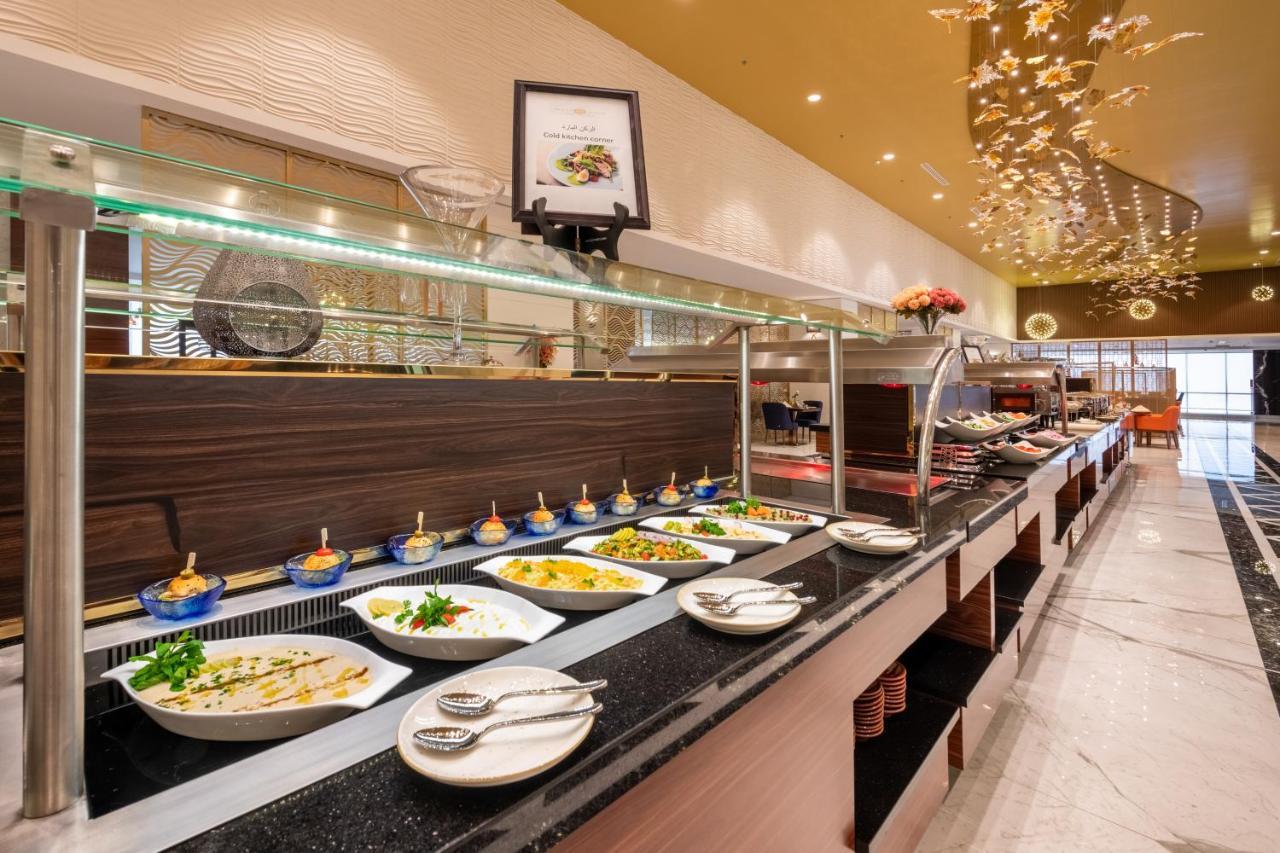 Nivel Hotel Abha Khamis Mushait Exteriör bild A buffet at a hotel